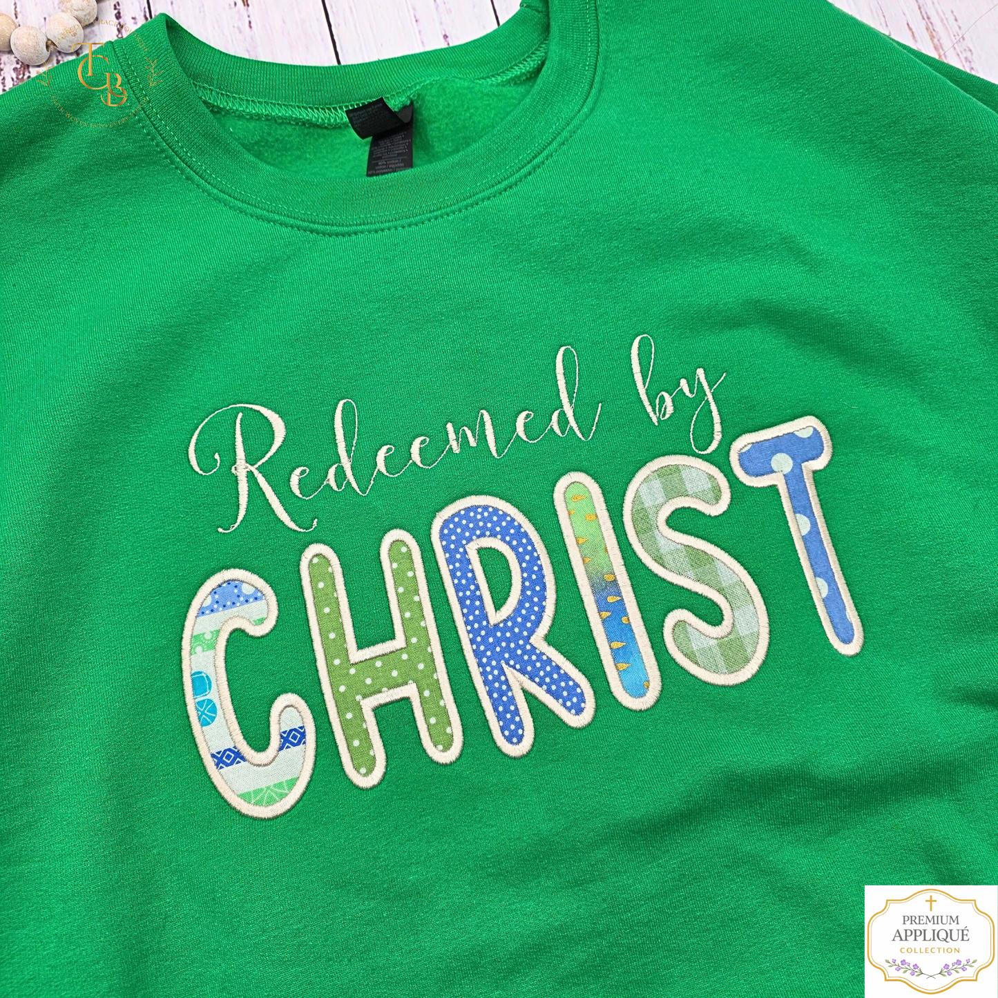 Redeemed by Christ Premium Appliqué Crewneck Sweatshirt – Embroidered Christian Boutique Pullover