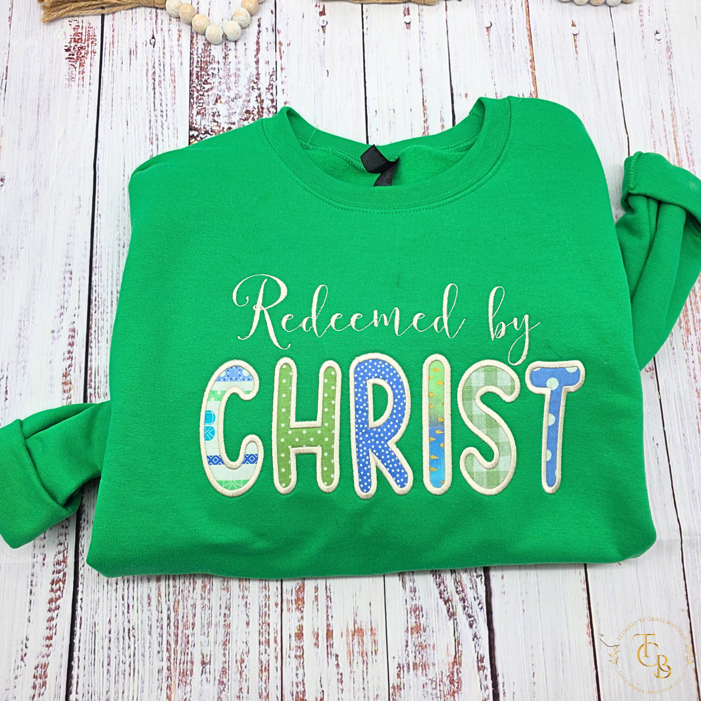 Redeemed by Christ Premium Appliqué Crewneck Sweatshirt – Embroidered Christian Boutique Pullover